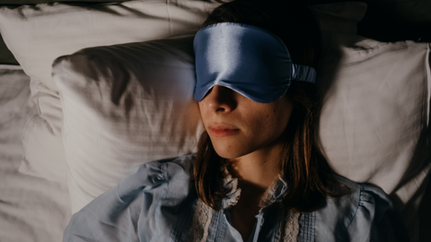 woman sleeping with face mask