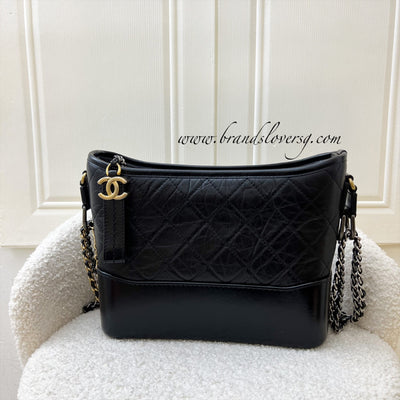 bag, chanel gabrielle small hobo bag, black bag, shoulder bag, jeans,  denim, blue jeans, jacket, top, black top, loafers - Wheretoget