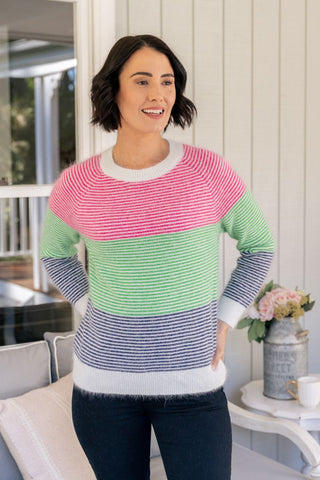 Women wearing striped pink, green, navy and white angora wool sweater by Australian fashion label, See Saw