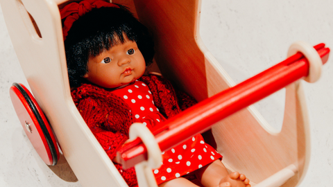 Miniland Doll in doll's pram