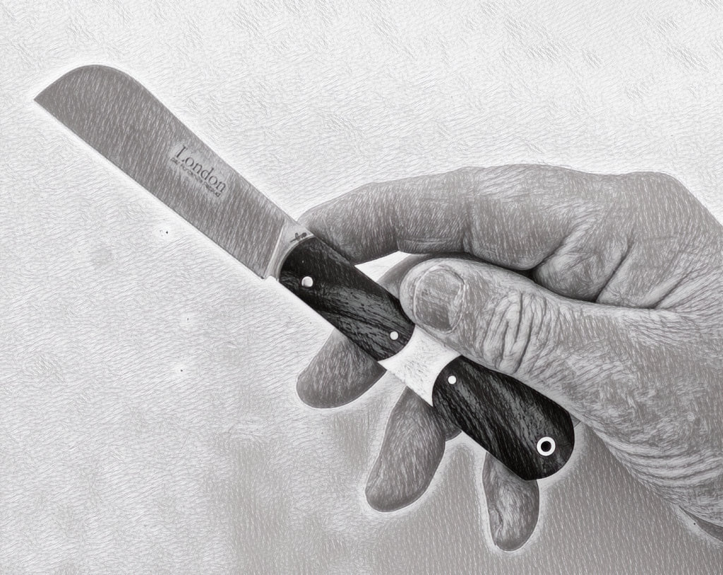 london 9 cm pocket knife held by adult hand