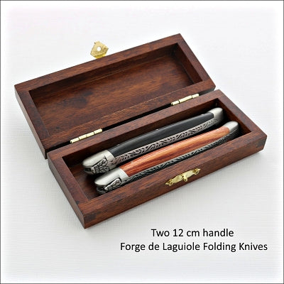 two laguiole folding knives in a small wooden box