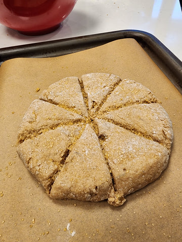 Round circular shaped dough scored into wedges for scones