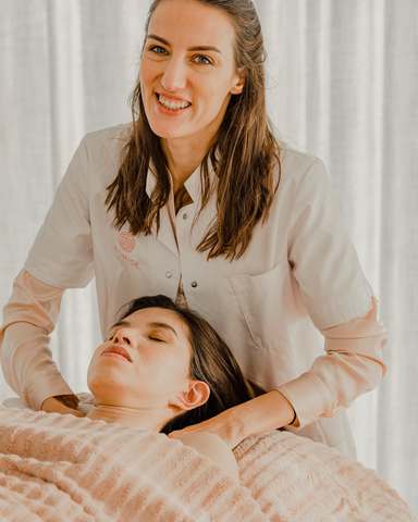 Women giving a facial massage