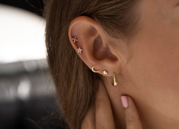 ear piercings and earrings on model