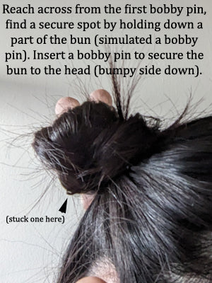 Use bobby pins to hold the hair bun into place