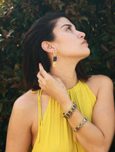 Load image into Gallery viewer, Woman with yellow dress and gold jewellery
