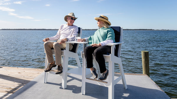 Image: Two Modern Lollygaggers sitting on a dock in two Hi-Rise Chairs with a 40 bridge that connects the two chairs.