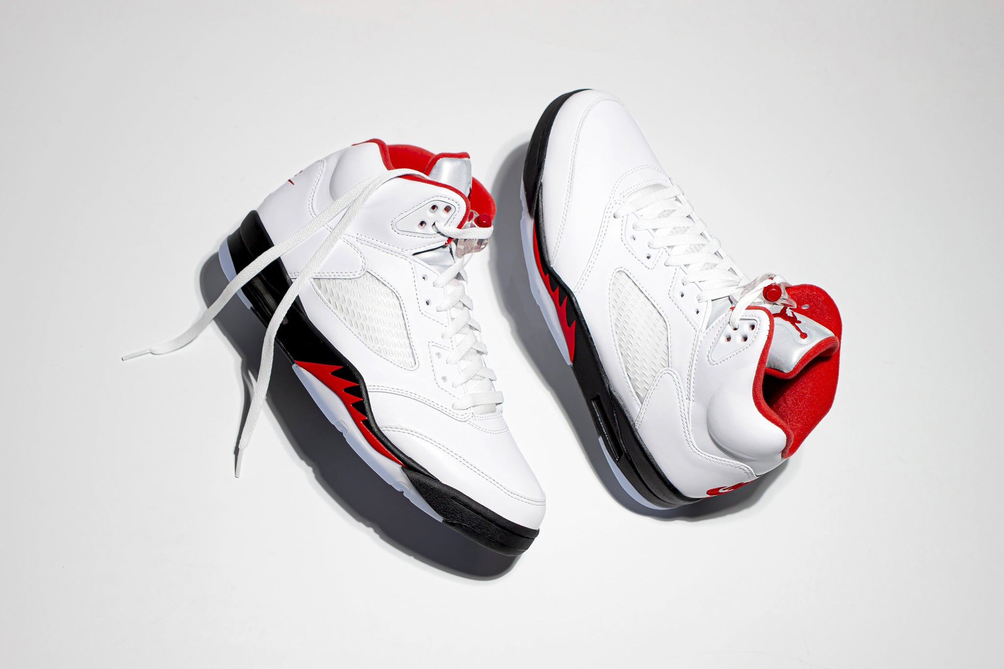 Profile view of Jordan 5 Retro Fire Red 2020 hi top sneaker