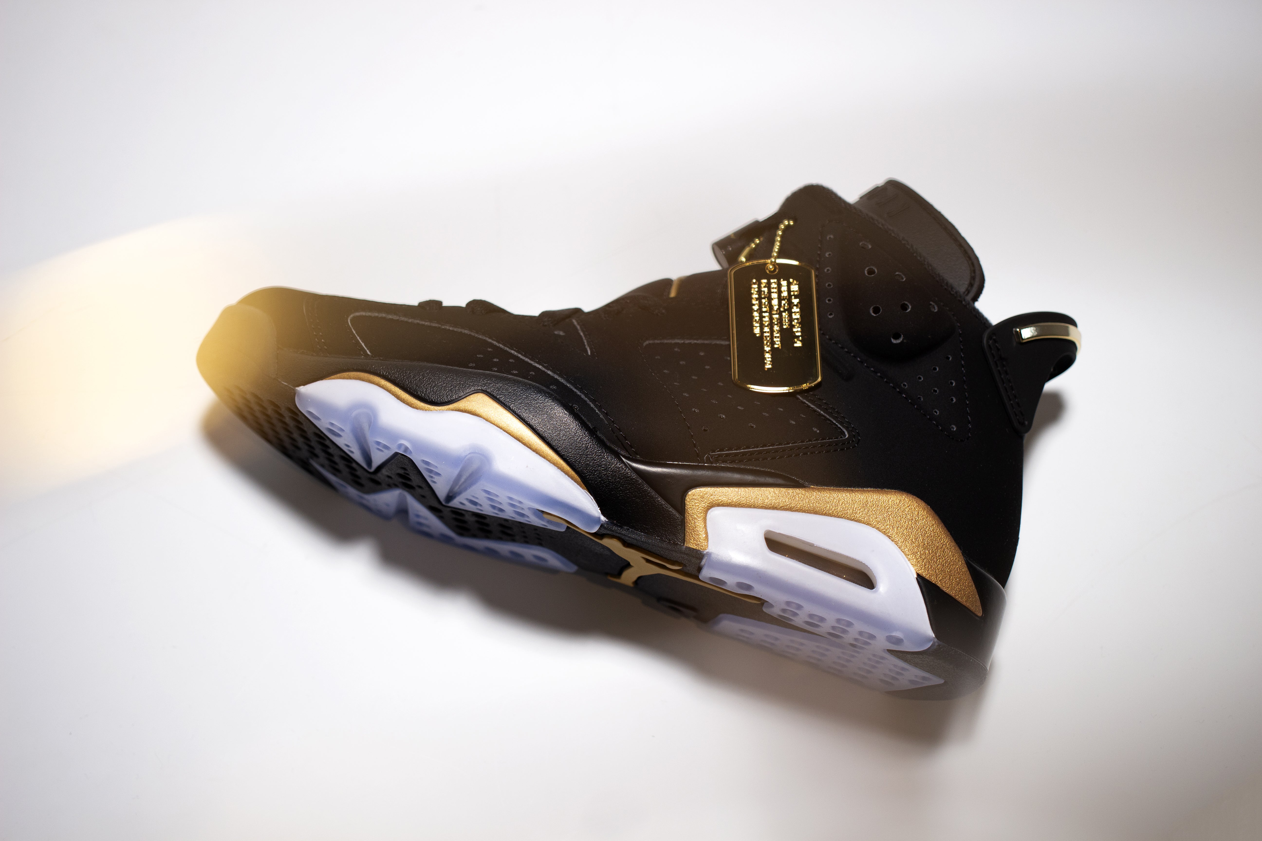 Black gold Jordan 6 defining moments hi top sneaker