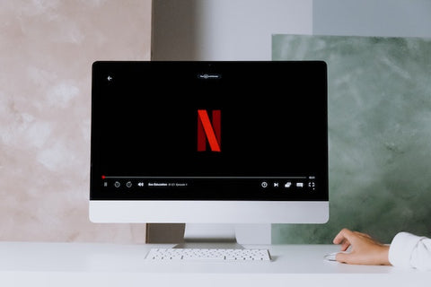 A computer monitor showing the opening screen for netflix.