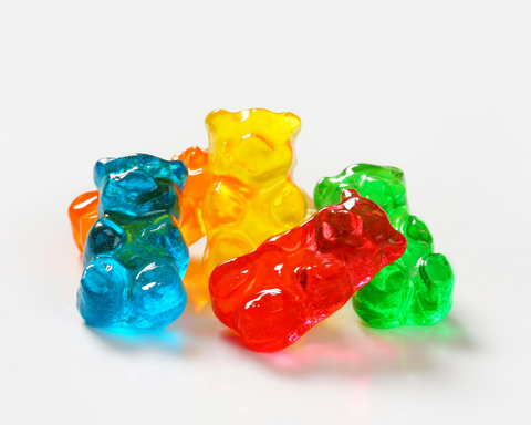 An arrangement of rainbow colored Delta 11 gummies