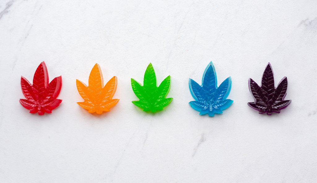 A selection of Delta-8-THC Gummies shaped as hemp leaves, a portable Delta-8 dosing style. 