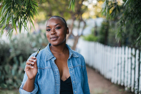 A woman using a Delta-8-THC vaporizer to reap the therapeutic benefits. 