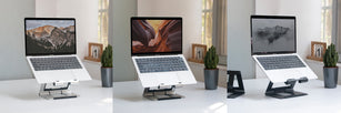 macbook air stand on a foldable laptop holder in silver, gray and black, on office desktop, near window