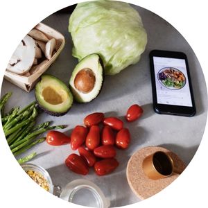 Fresh Produce on a Table with a Phone