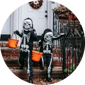 Kids in Skeleton Costumes Trick or Treating