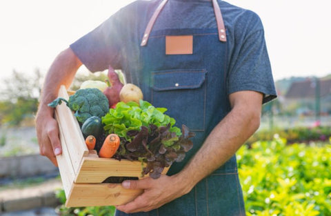 Farmer Holding a Box of Produce