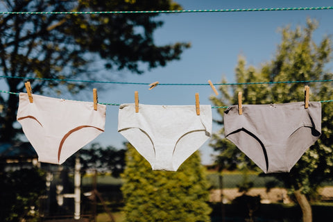 underwear hanging up to a dry on a laundry line