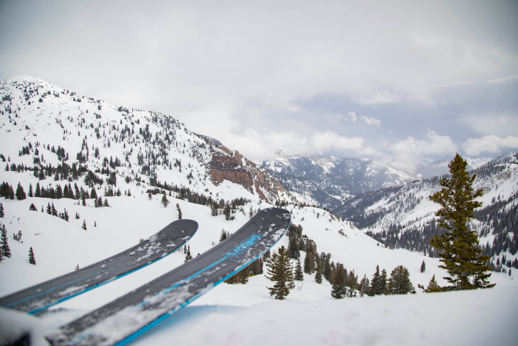 Overlooking Mineral Basin at Snowbird Utah with Mohawk 98 all mountain skis in frame