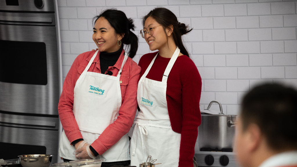 Ashley and Hedy posing for photo during Stony Brook University's tang yuan cooking class during Lunar New Year 2023.