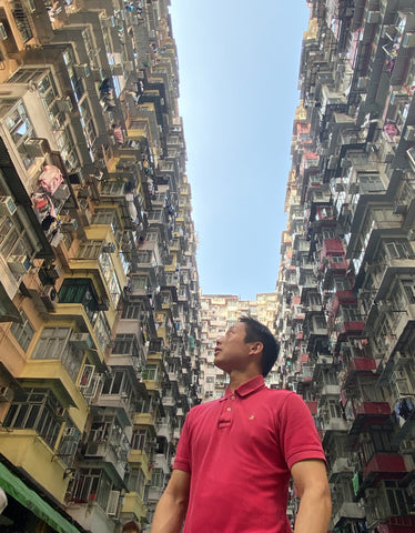 Vincent looking at the apartments in monster building in Hong Kong