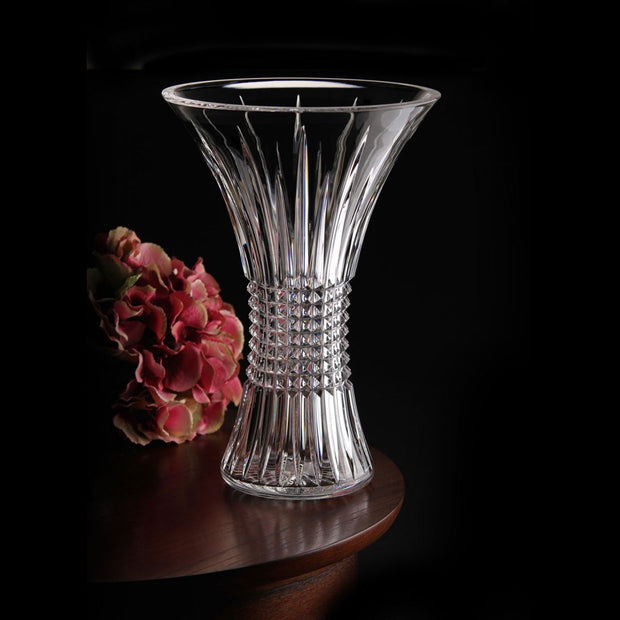Lismore Diamond 14 in Vase by Waterford Crystal  Perfect for displaying a floral bouquet or two dozen roses, this Lismore Diamond 14in Vase beautifully showcases its contents. The combination of its tall, 14in profile and enchanting flared rim enables cut flowers to stretch out into their surroundings, producing an eye-catching display of colour that breathes life into your home.