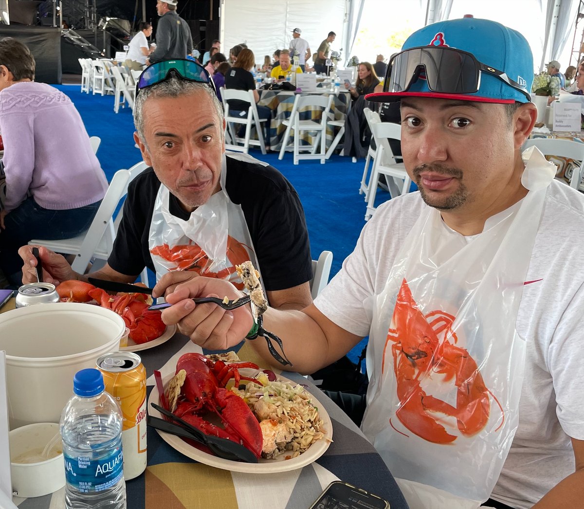 CHRIS PAVON AND ANDRE QUIRINO EATING LOBSTER AT THE CLAMBAKE FOR THE BEST BUDDIES CHALLENGE HYANNIS PORT