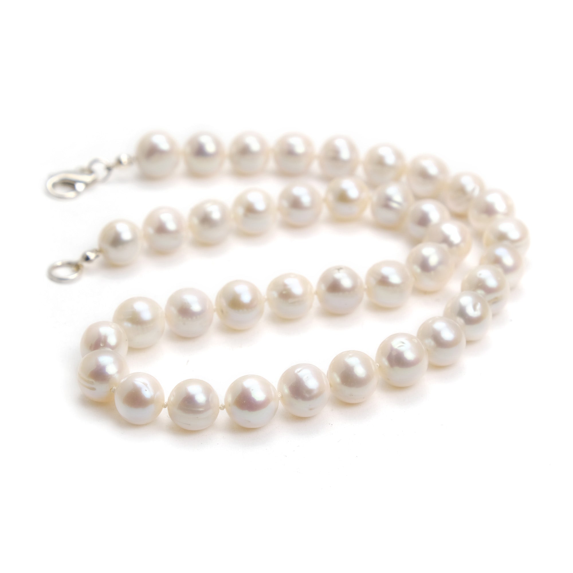 Pearls. Beautiful cream knotted fresh water stick pearl necklace. The  necklace is finished with a quality sterling silver magnetic clasp.