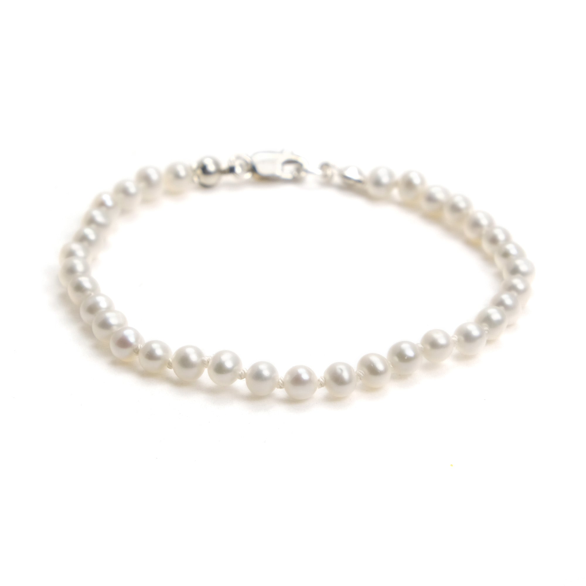 Pearls. Beautiful cream knotted fresh water stick pearl necklace. The  necklace is finished with a quality sterling silver magnetic clasp.