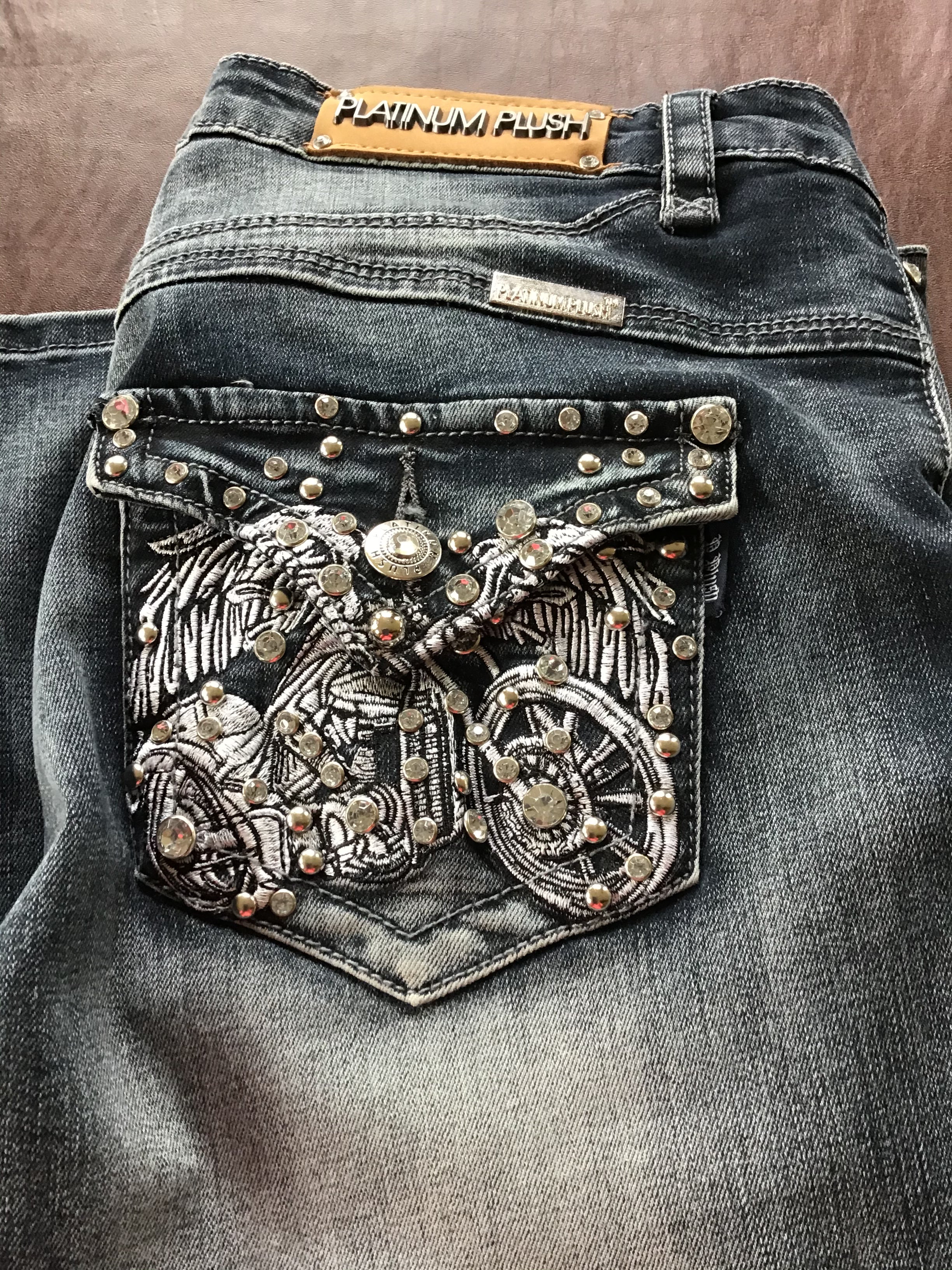 Boot cut denim biker jeans on back 