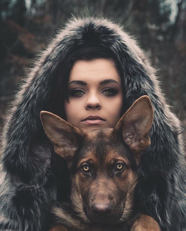 dog with human wrapped in person's faux fur coat