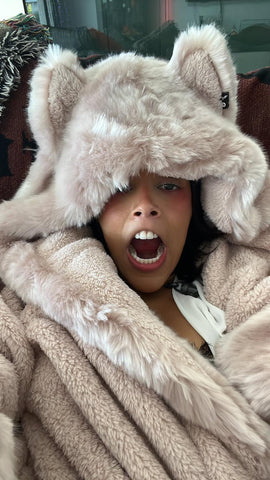 Doja Cat wearing the SpiritHood Rose Quartz Wolf faux fur robe