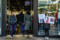 Protestors standing outside of store protesting real fur