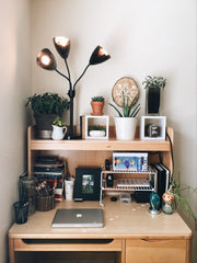 dorm room desk with items and fun light