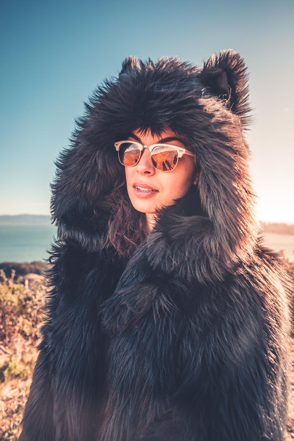 person wearing faux fur jacket