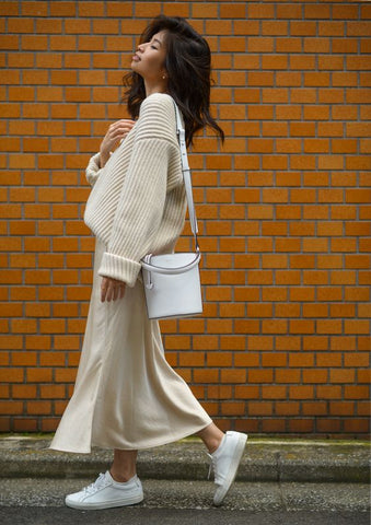 Woman wearing satin skirt