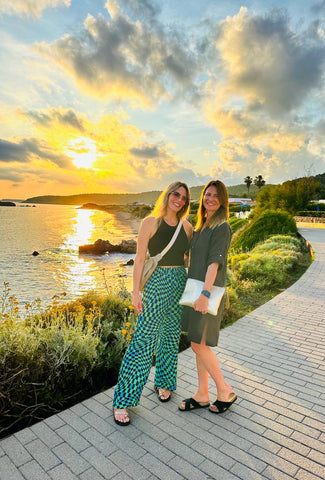 two ladies wearing palmaira sandals by the sunset in menorca