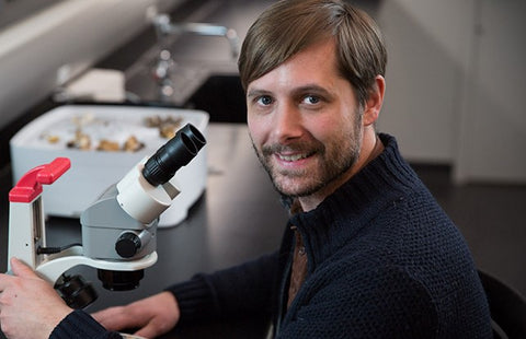 bryn in the lab with a microscope