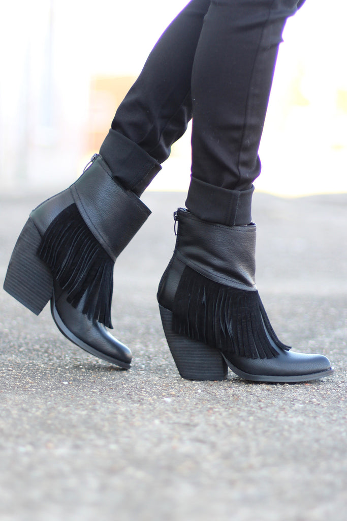 very volatile black booties