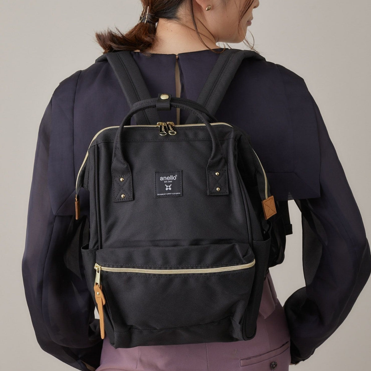 Anello Cross Bottle Backpack Small in Black