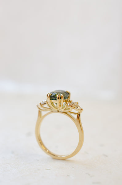 Teal sapphire oval engagement ring 18ct yellow gold