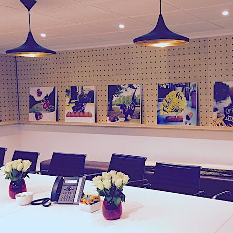 Large custom pegboard wall in an office by Kreisdesign