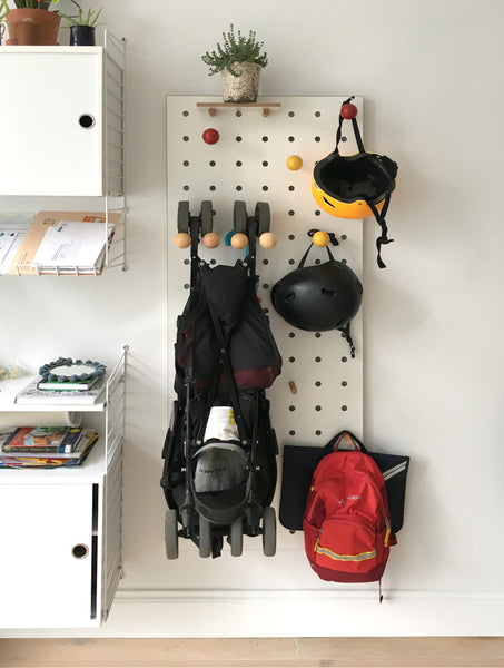 Entryway Pegboard with buggy holder