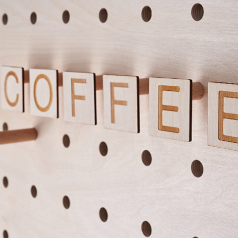 Custom Letters on pegs for coffee shop pegboard by Kreisdesign
