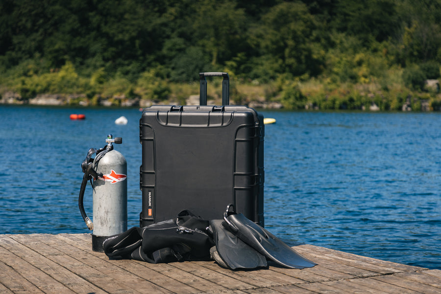 Nanuk 976 with diving gears on a deck