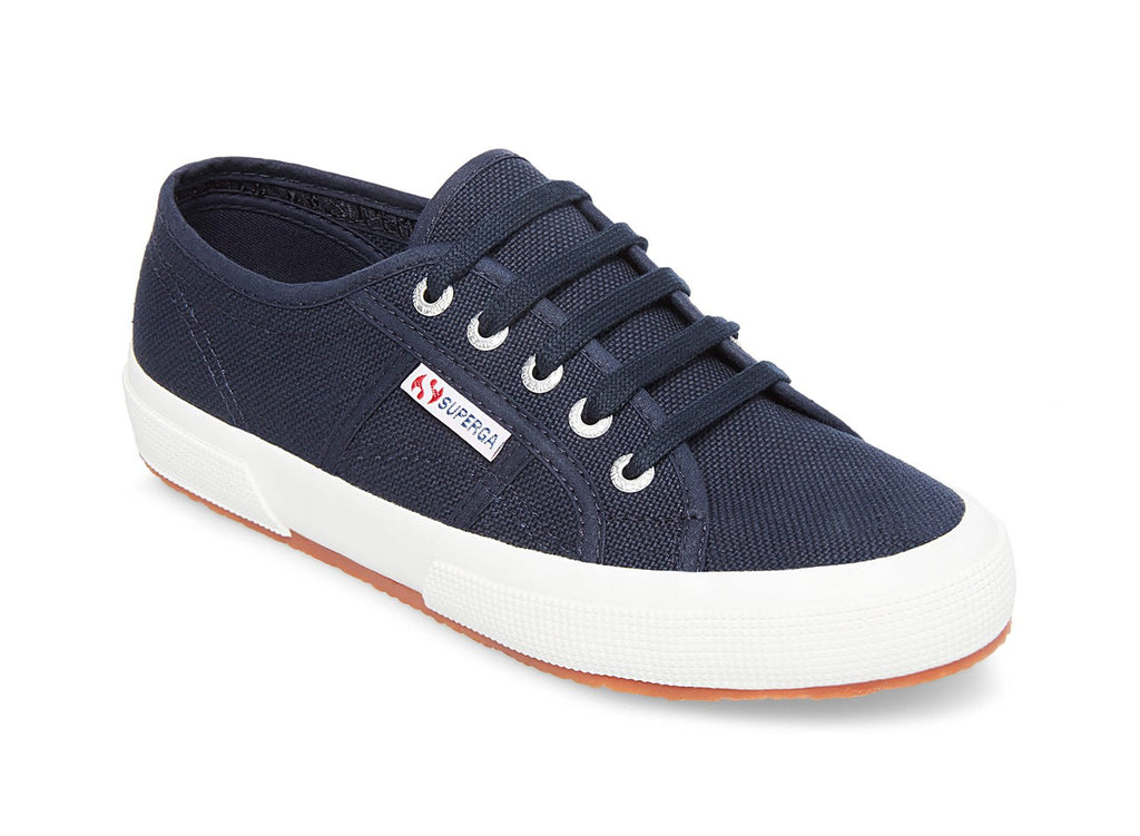 Superga 2750 - The Classic Lace Sneaker in Navy. Classic never goes out of style. Simple, flattering, lace up silhouette. Washable canvas. Very comfortable. This is one sneaker you can wear all summer and beyond. Timeless.