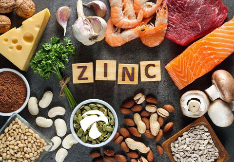 Vegetables and other foods full of zinc on a board