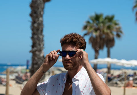 Man wearing sunglasses to protect his eyes from the sun