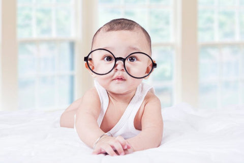 baby with blue light blocking glasses